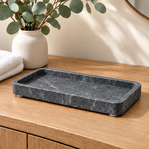 Jorlenna charcoal rectangular stone tray on a bathroom counter